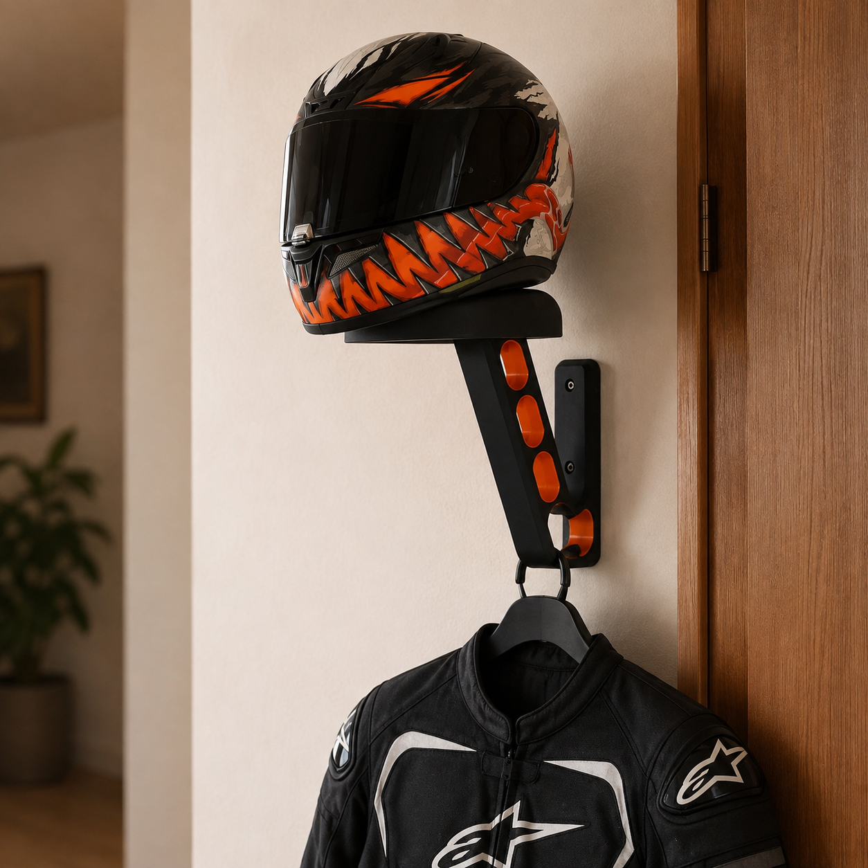 Wall-mounted motorcycle helmet organizer with single lower hook for light riding gear