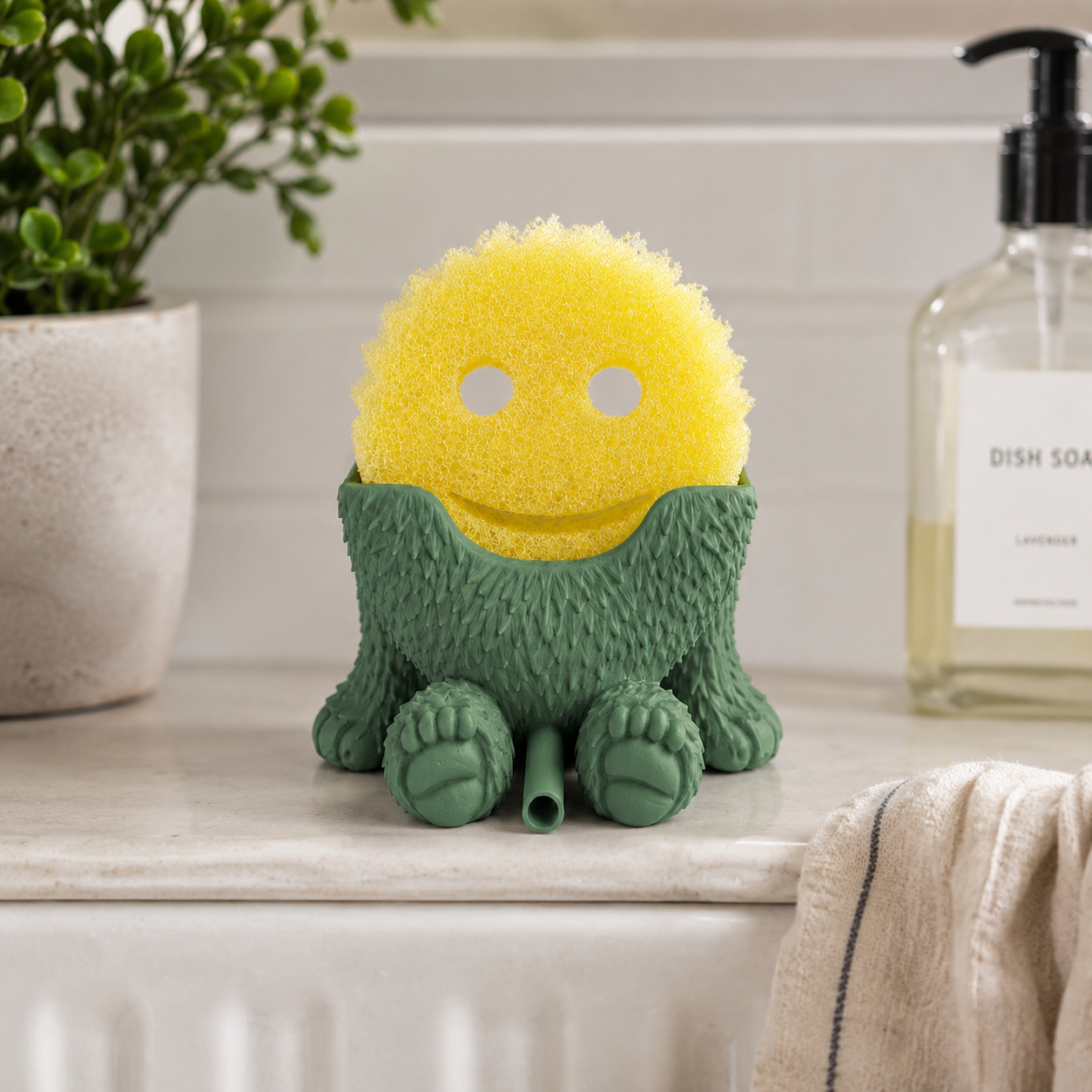 Kitchen sink sponge organizer with Bigfoot design for smiley scrub sponges