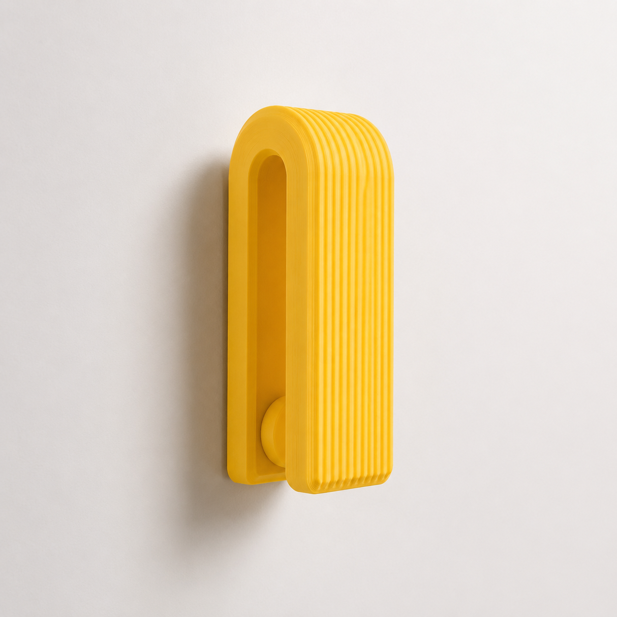White ribbed gravity towel hook with white bathroom towel
