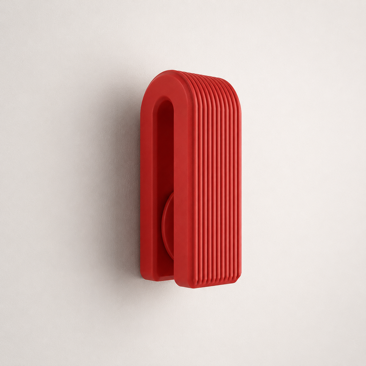 Black ribbed gravity towel hook with dark kitchen towel