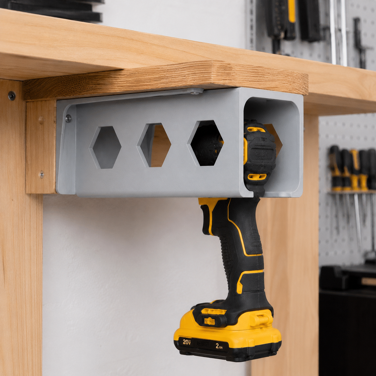 Solid 3D printed cordless drill holder in a workshop storage setup